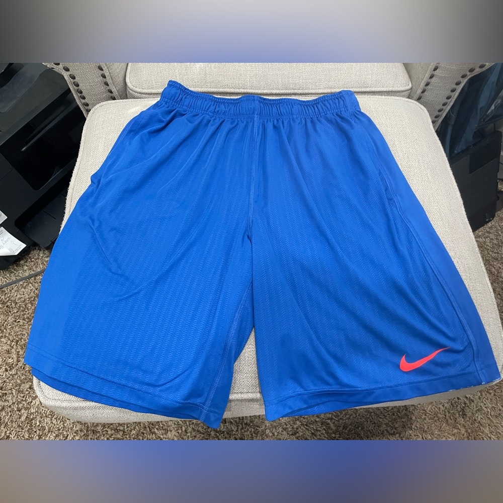 Nike Dri-fit basketball shorts.  Orange and Blue